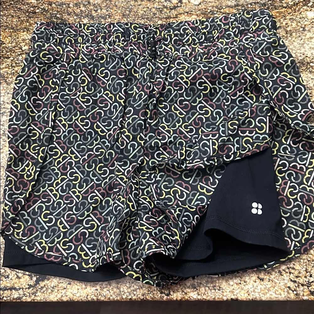 $98 SWEATY BETTY SLIP STREAM RUNNING SHORTS in Black SB Slot ‎ Print Size Small